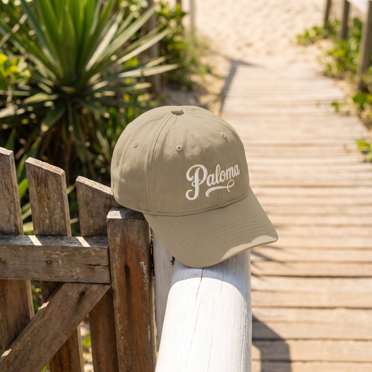 Paloma Script Cap in khaki with cream Paloma embroidery, at Grumari beach, Rio